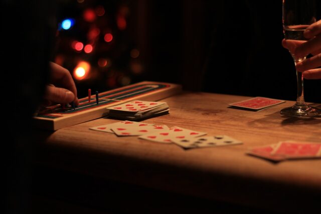 playing cards on brown wooden table